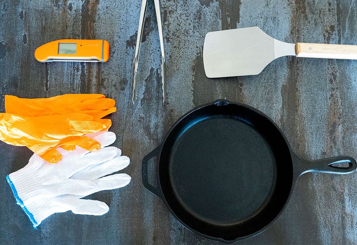 meat thermometer, tongs, spatula, gloves and cast iron skillet.