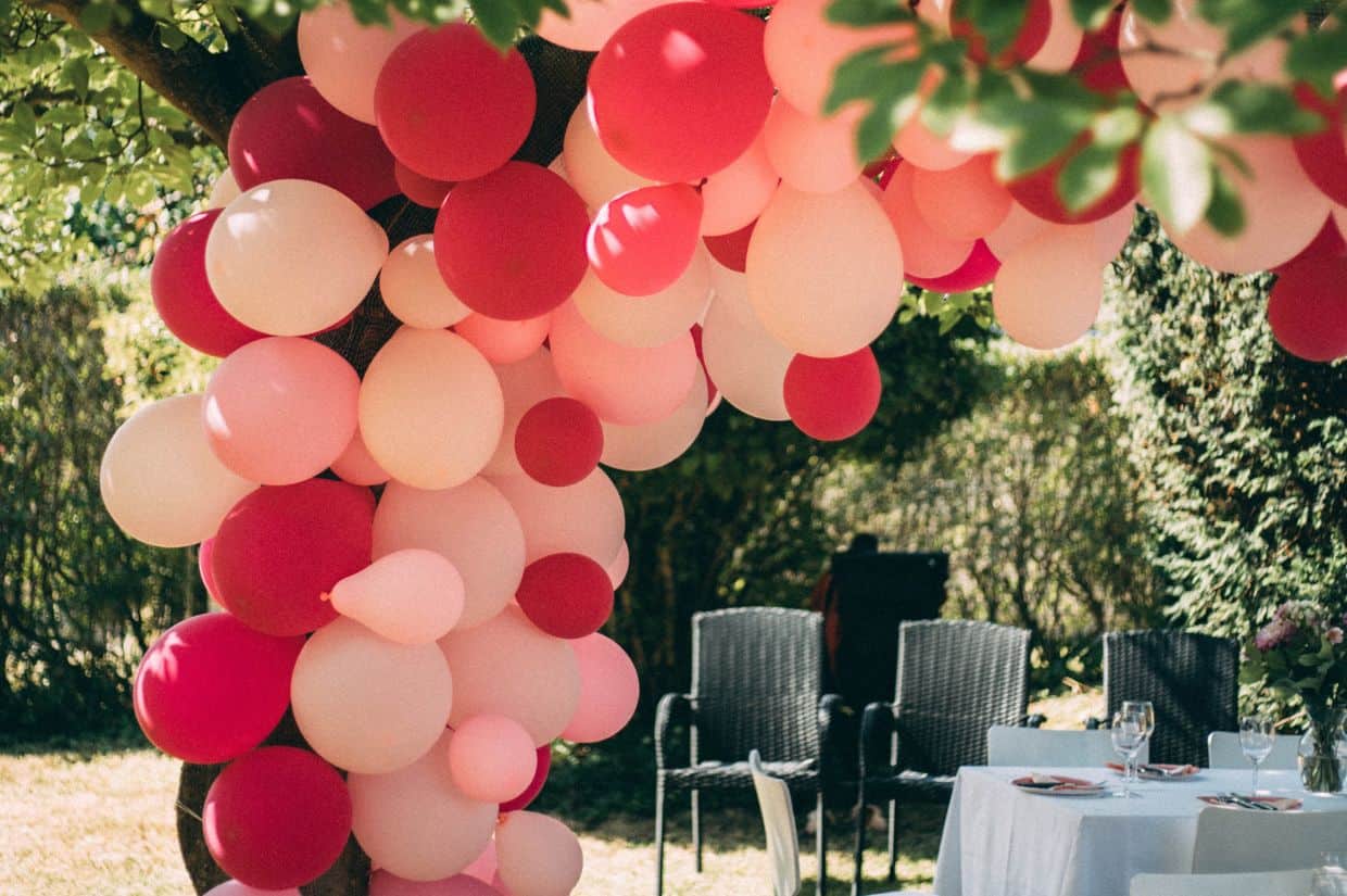 Red, white and pink outside balloon arch.