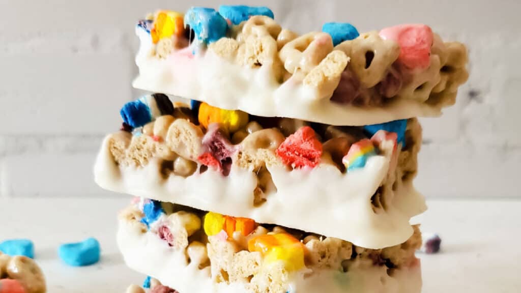 White choclate dipped Lucky Charms Bars stacked.