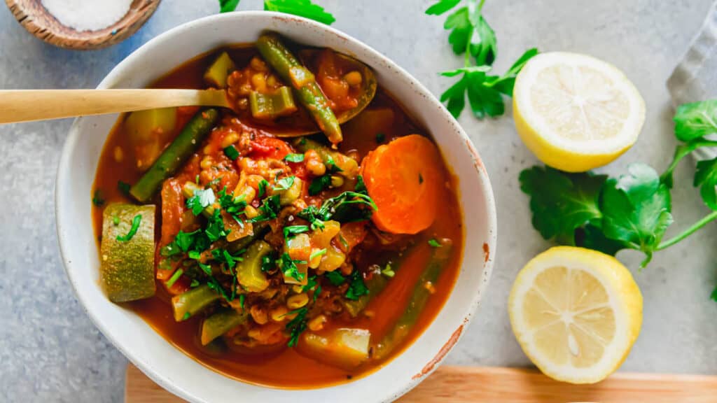 Mung bean soup in a bowl with gold spoon.