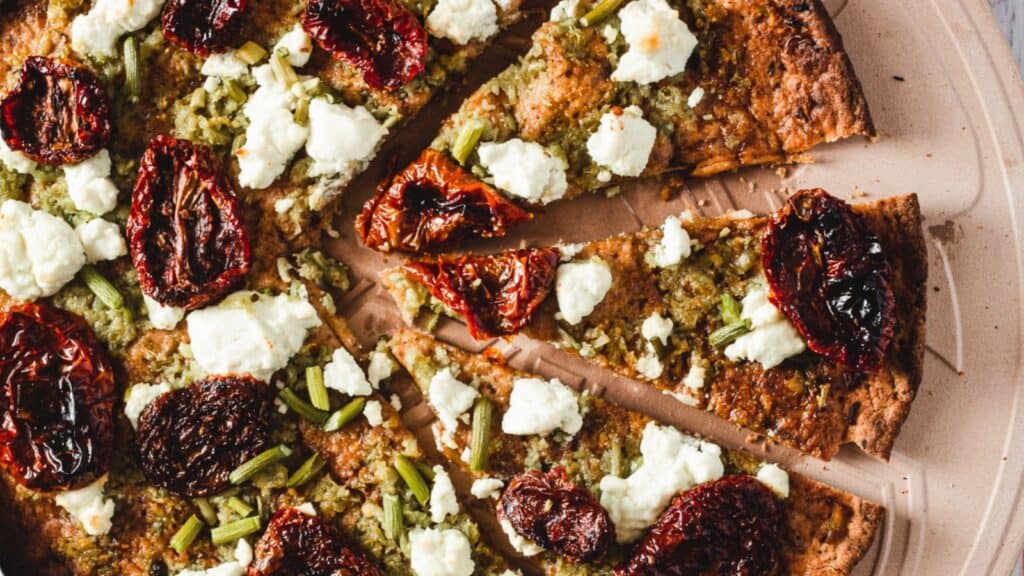 overhead of garlic scape pesto pizza.