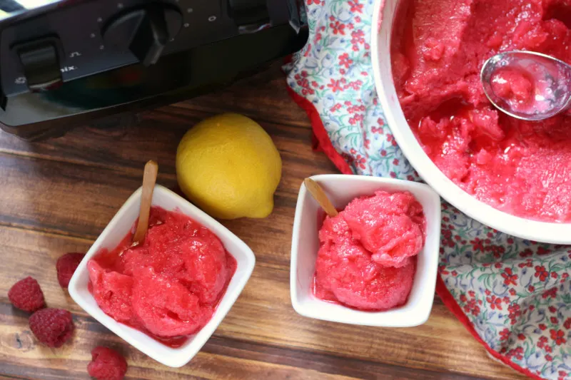 two bowls of raspberry lemonade sorbet and a blender