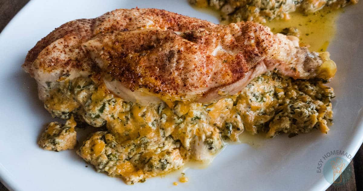 Stuffed chicken on a white plate.