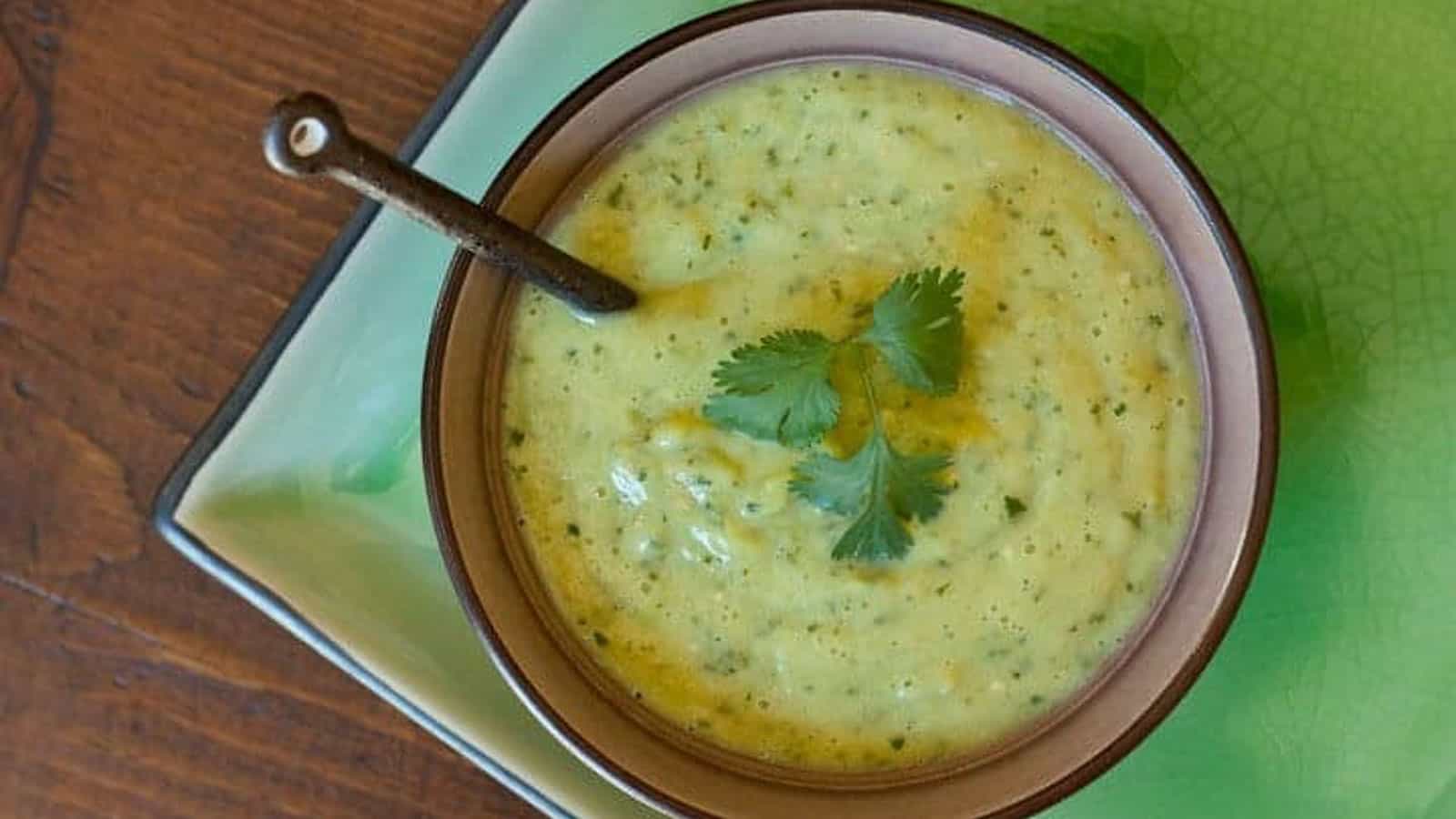 Salsa verde in a bowl with cilantro leaves on top.