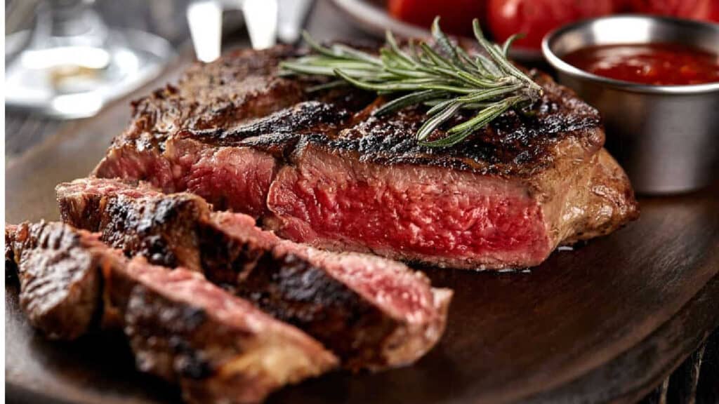 Low angle shot of a sliced medium-rare steak.