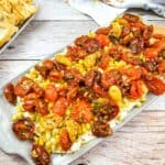 Tomato bruschetta board on a table.