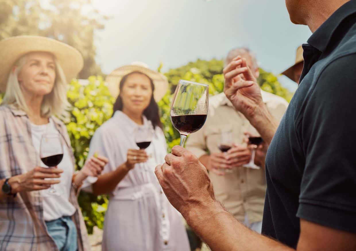 Group of people wine tasting on a farm.