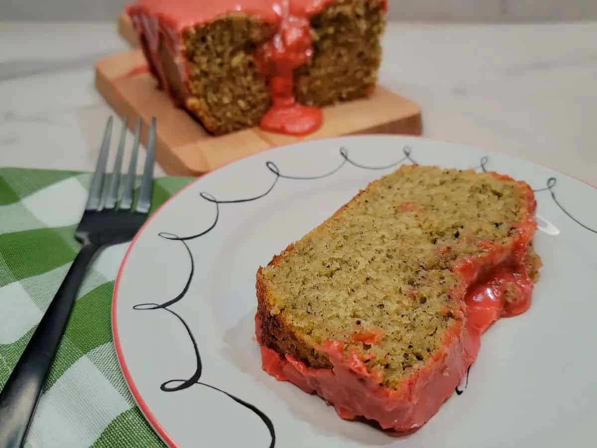 A slice of lavender chamomile cake on a decorative plate.