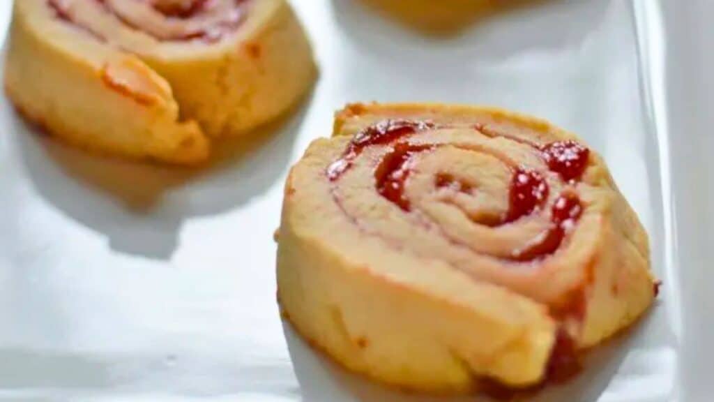 Image shows Cherry Pie Cookies close up on a white plate.