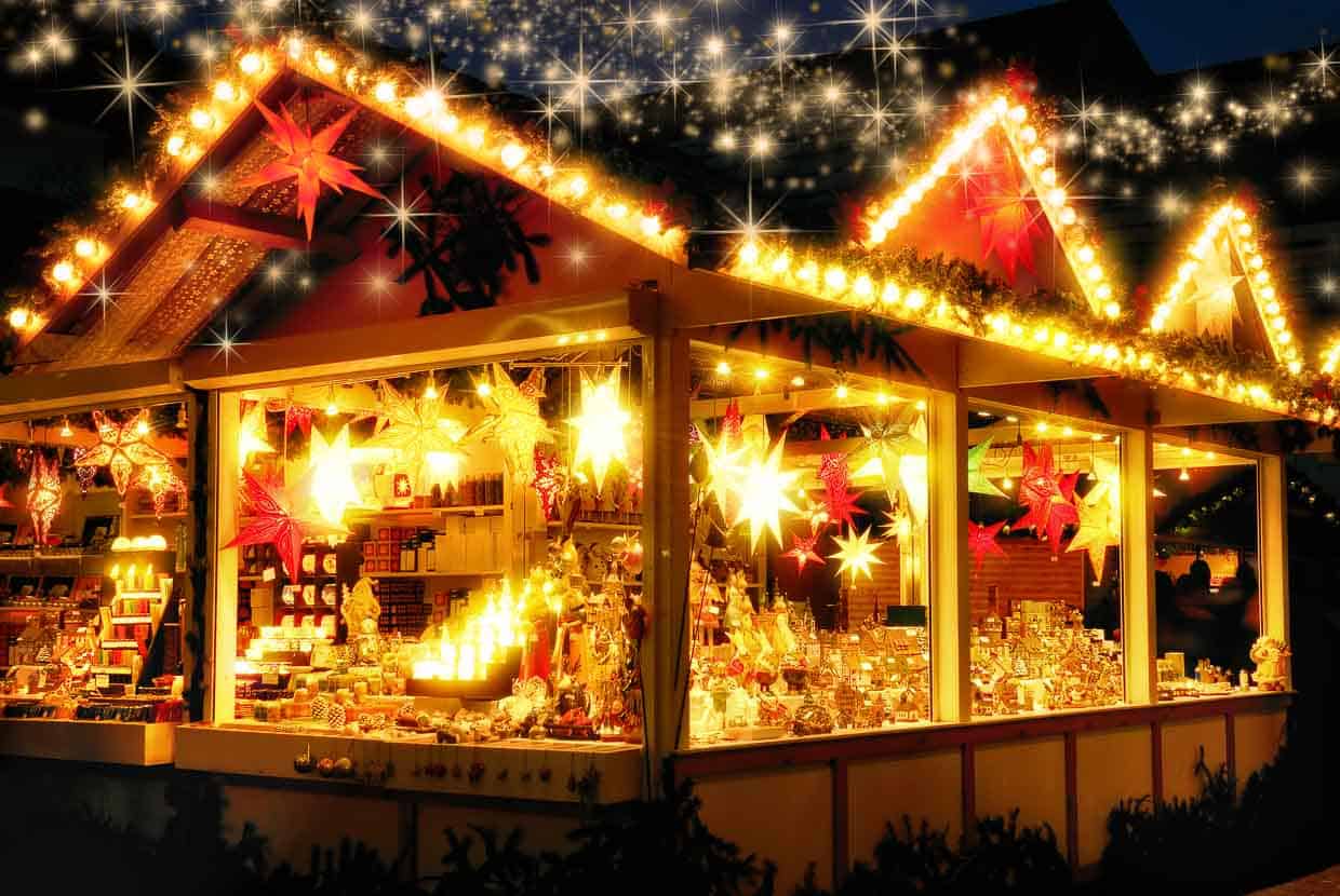 An illuminated Christmas market stall.