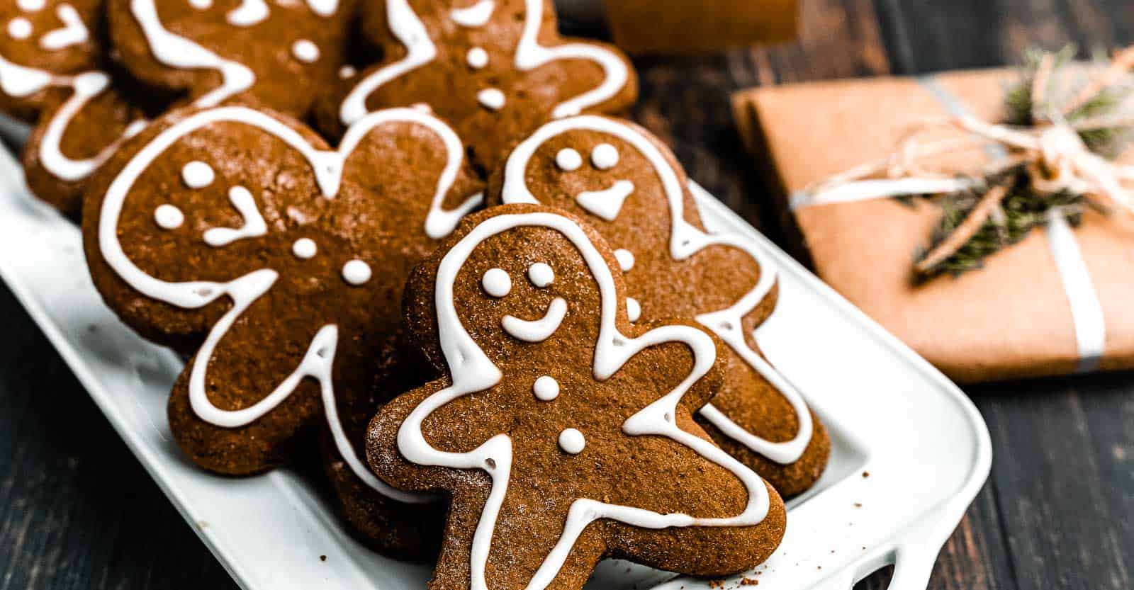 Close up of gingerbread cookies on a white plate.