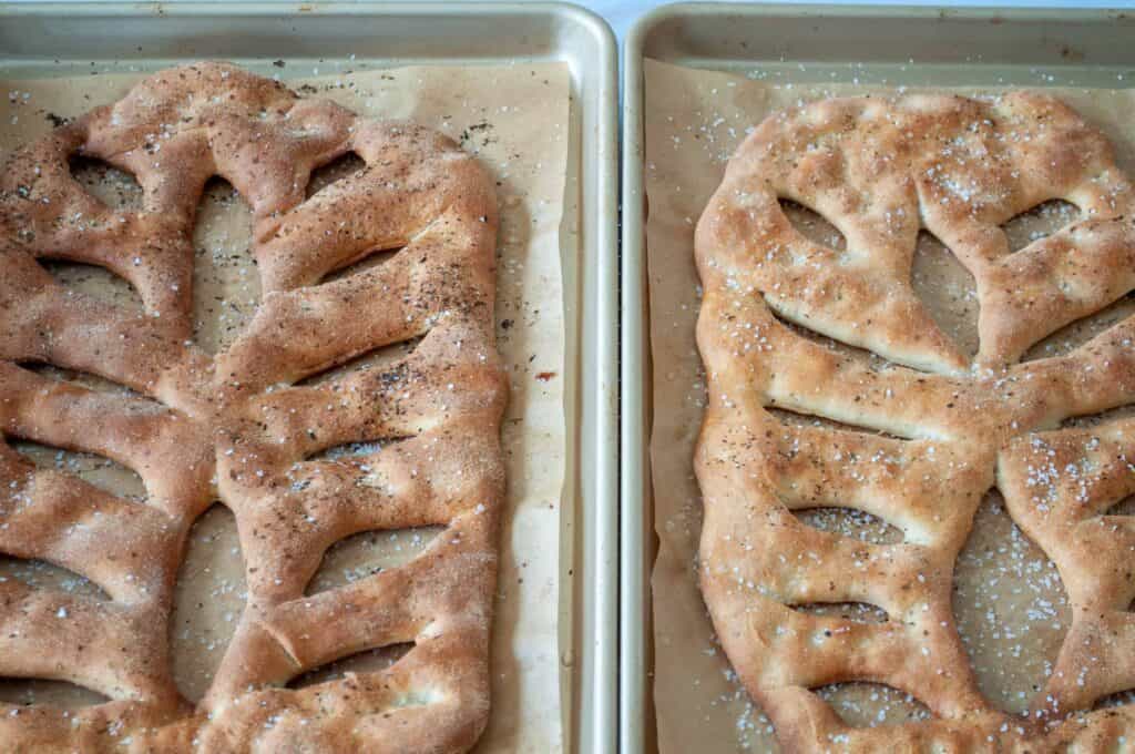 Two fougasse on baking sheets with parchment paper. 
