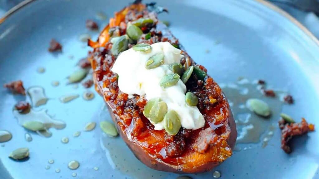 Sweet potato half topped with chorizo, maple and sour cream.