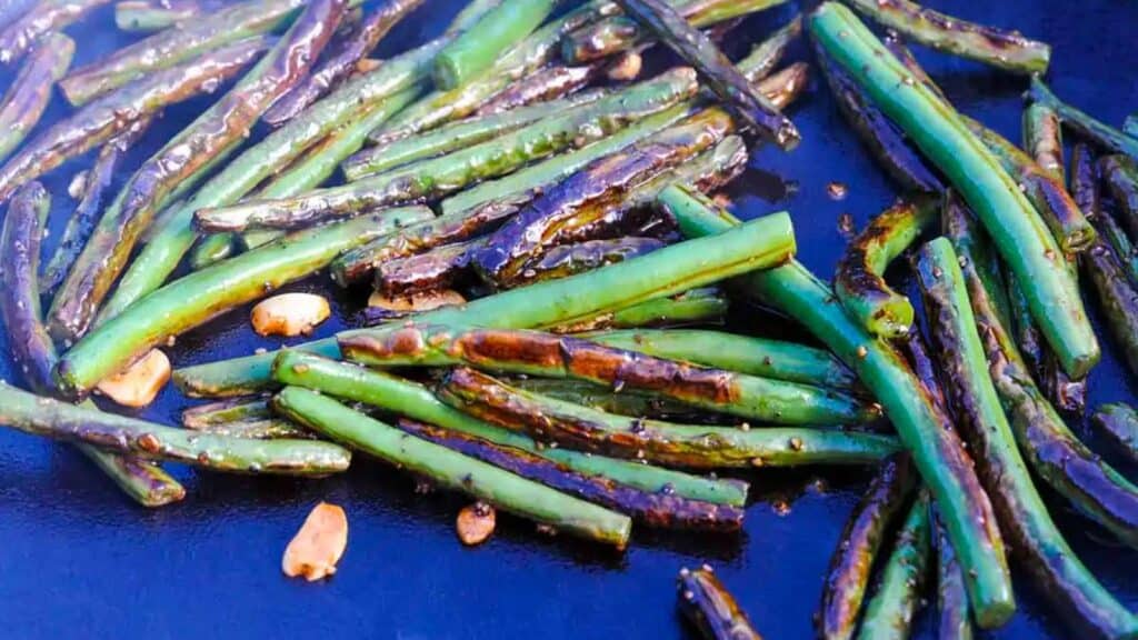 Skillet of sauteed garlic green beans.