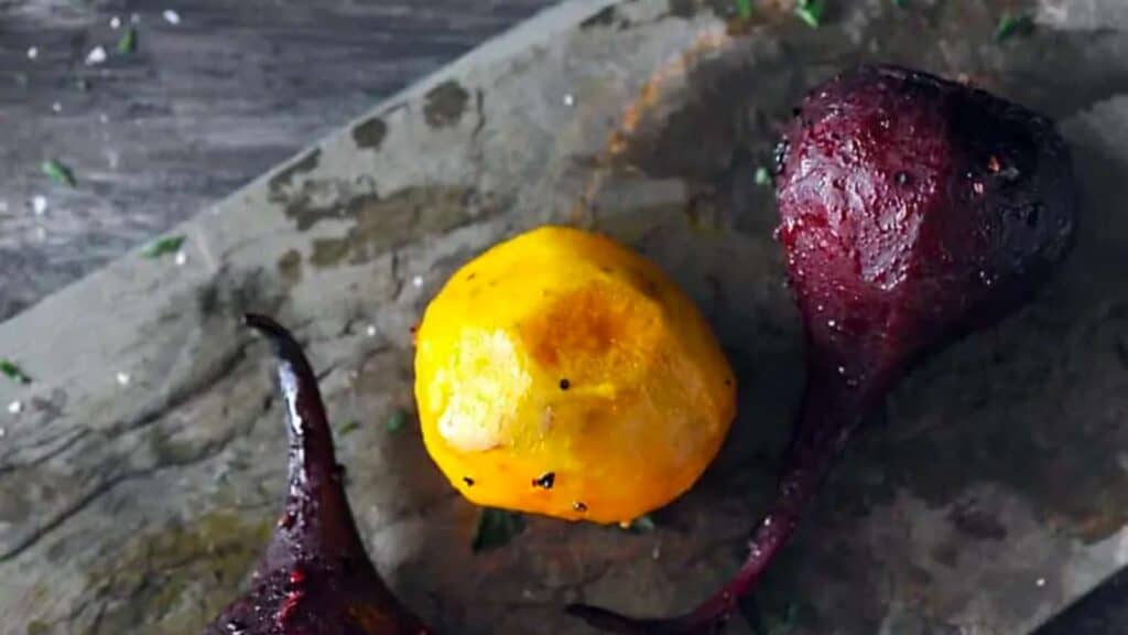 Grilled, peeled yellow and purple beets.