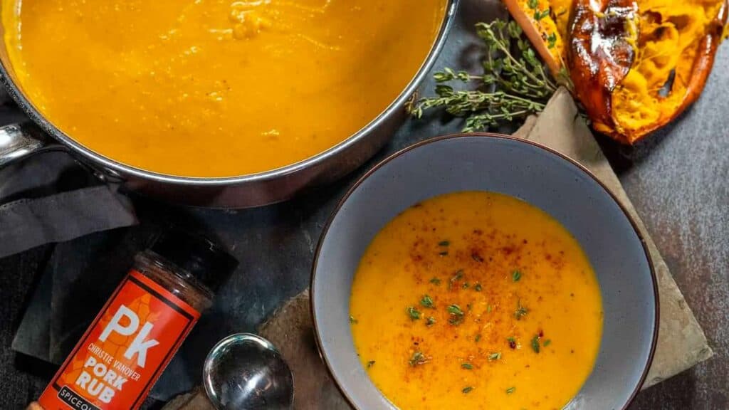 Bowl and pot of grilled butternut squash soup.