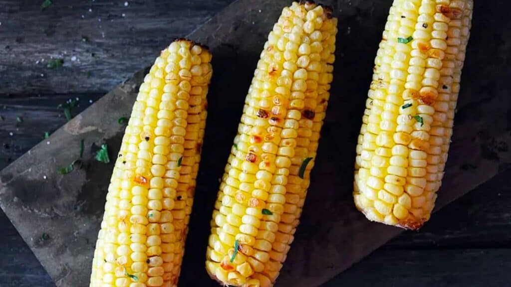 Platter of 3 ears of grilled corn.