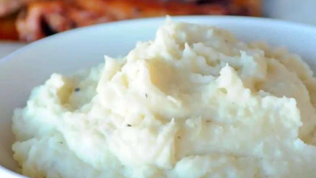 Bowl of fluffy mashed potatoes.