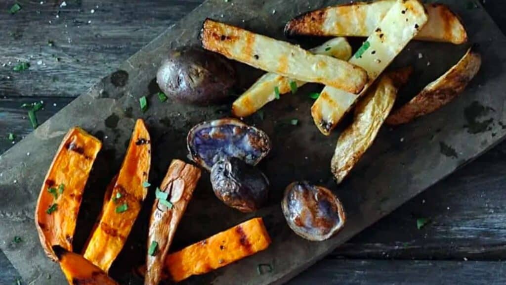 Platter of grilled potato wedges and halves.