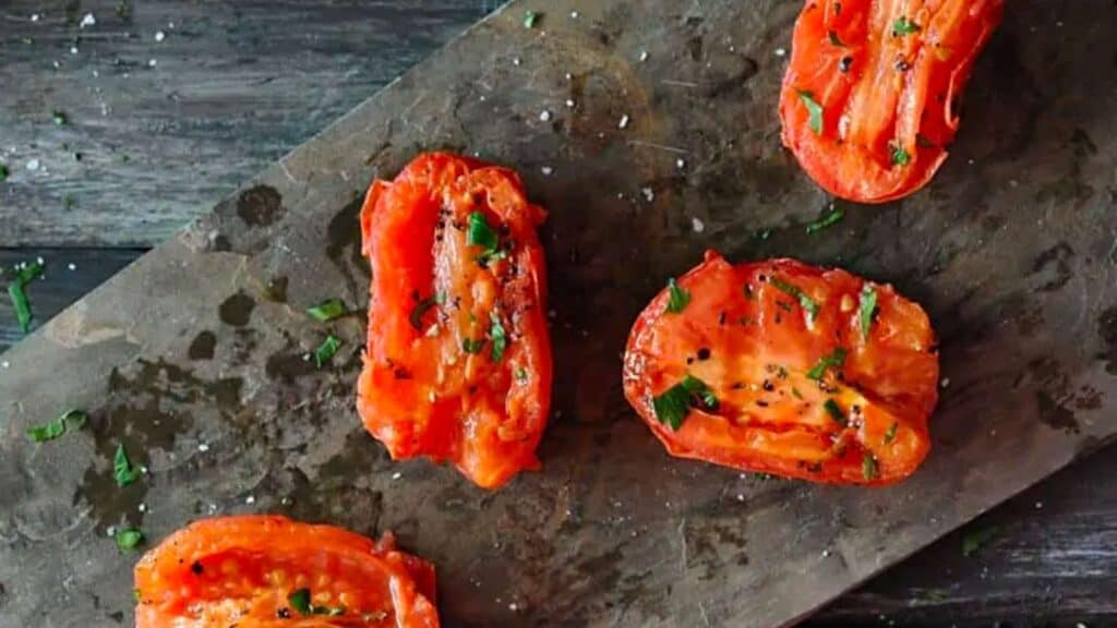 platter of grilled roma tomato halves.