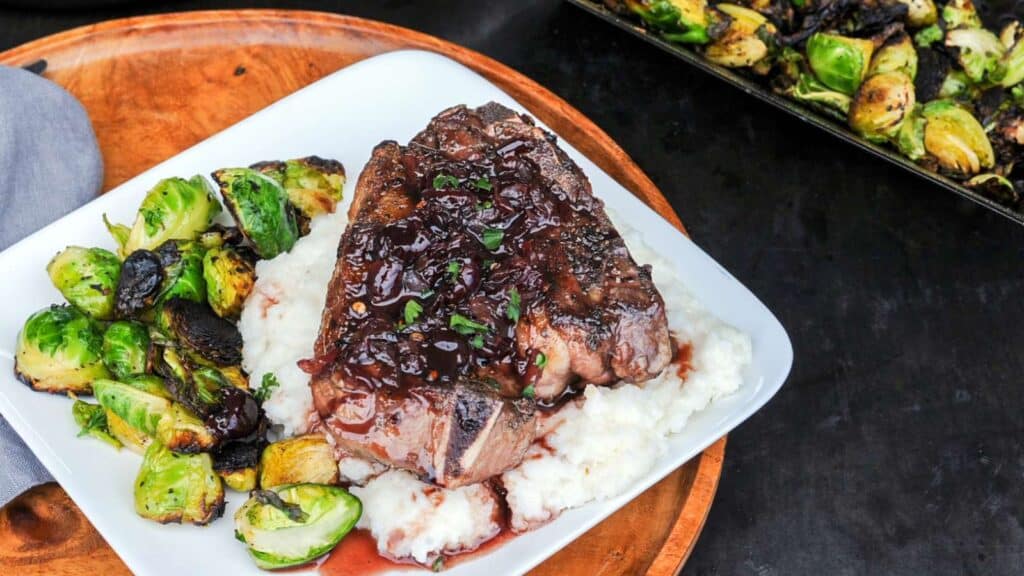 Grilled lamb chop with cherry glaze.