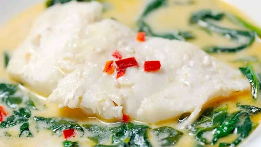 Poached cod in coconut milk with spinach.