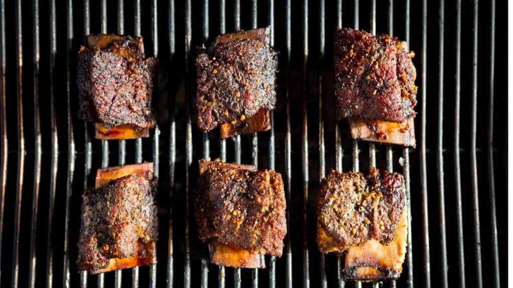 Six beef short ribs on smoker.