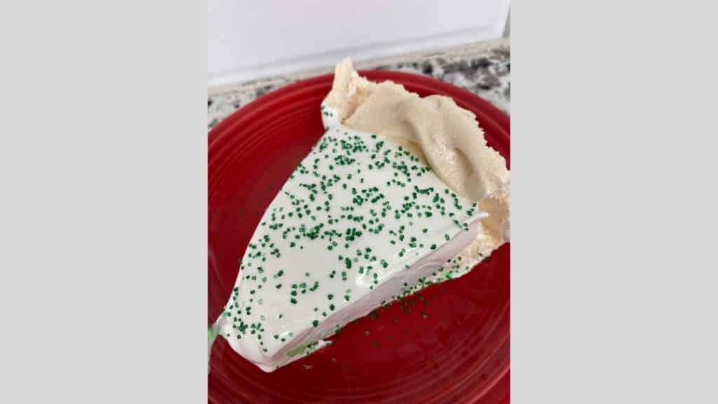 Lime pie on red plate.