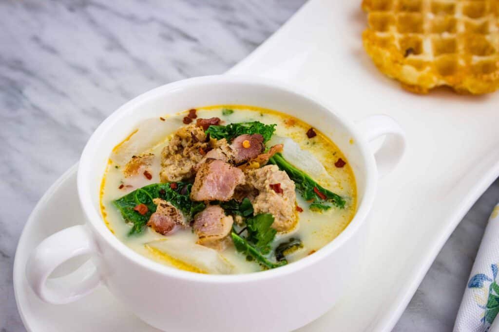 Low Carb Zuppa Toscana Soup in a white round bowl with small handles.