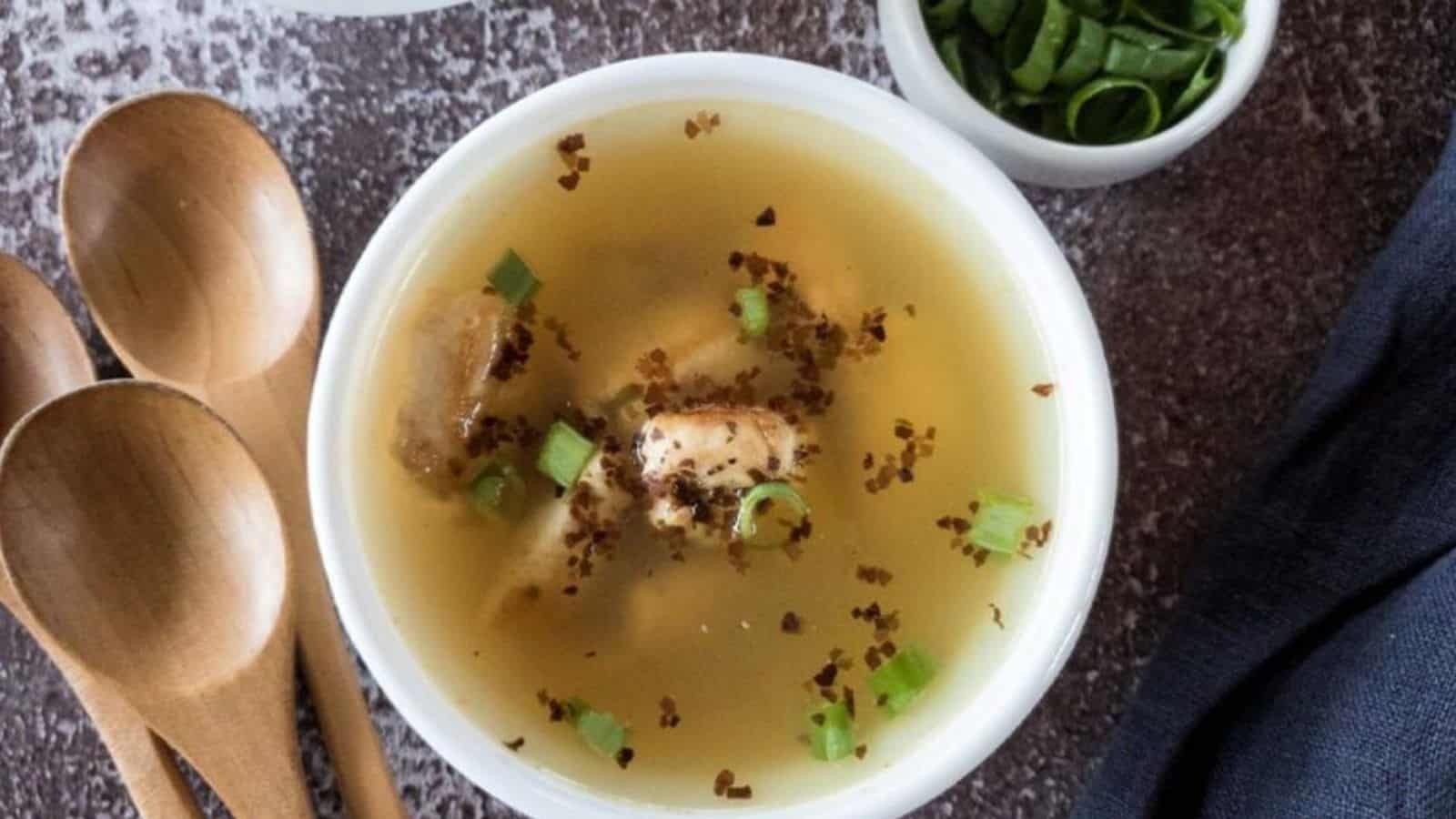 Chicken Miso Soup with seaweed and green onion garnish in a white soup bowl.