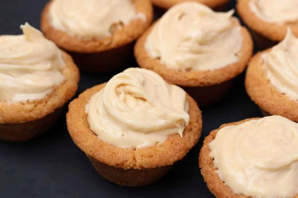Peanut butter cookie cups with black background.