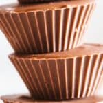 Close up of a stack of peanut butter cups with blurred background.