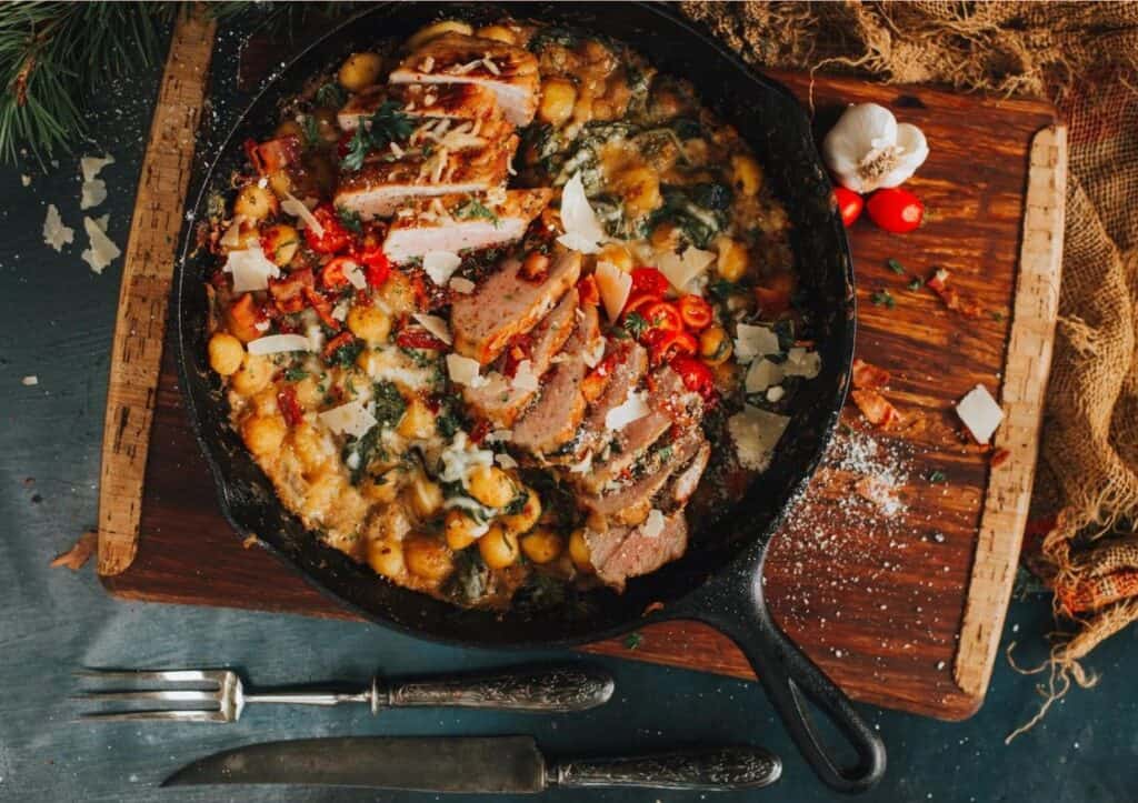 Overhead skillet with pork and gnocchi.