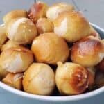 Image shows a bowl filled with homemade Pretzel Bites.