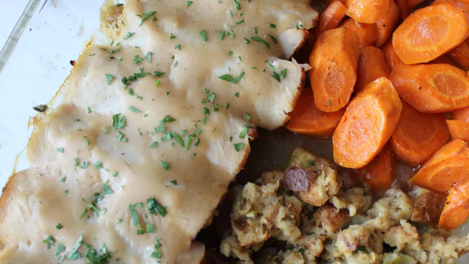 Turkey rolls with stuffing and cooked carrots.