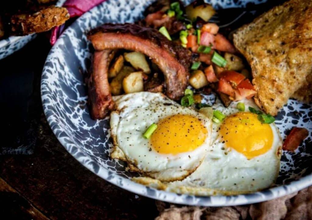 Breakfast has with fried eggs close up.