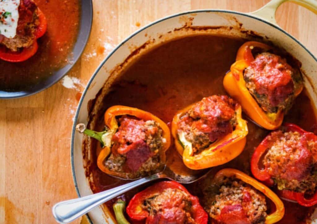 Lamb stuffed peppers in a pot.