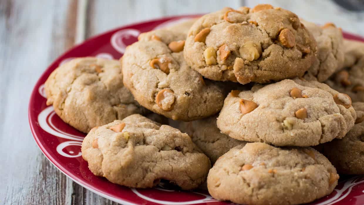 Butterscotch cookies on a red plate.