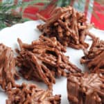 No bake haystack cookies on a white cake stand.