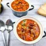 Pasta e Fagioli Soup in 2 bowls with spoons.