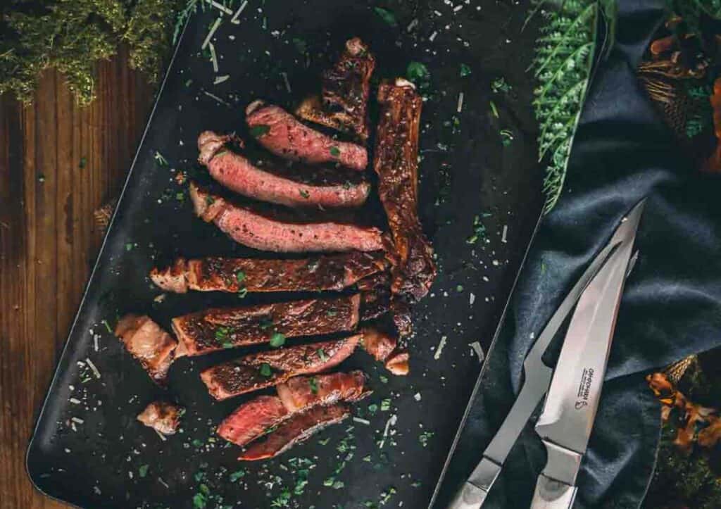 Sliced ribeye steak for serving.