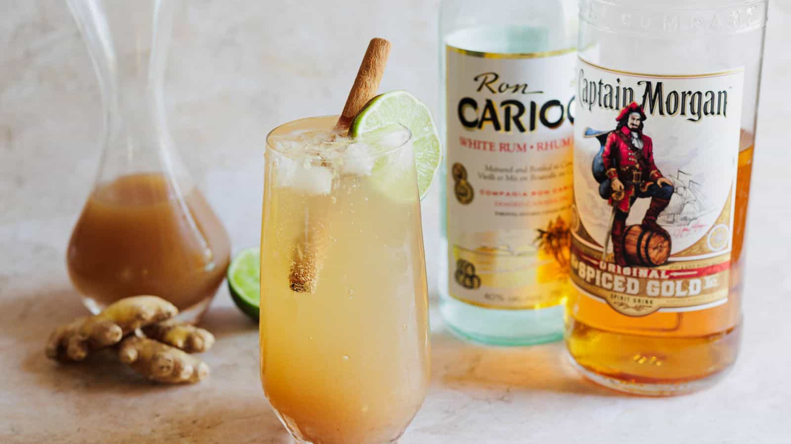 Tamarind cocktail with rum bottles in background.