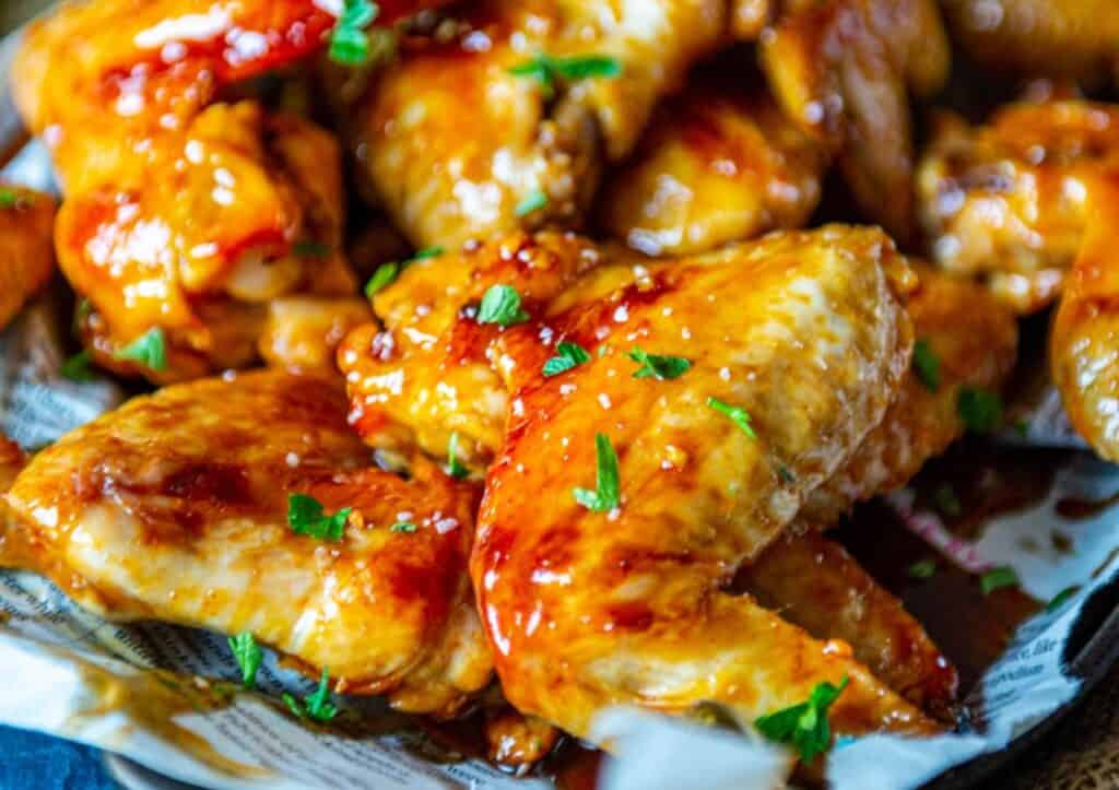 Close up of chicken wings showing sticky glaze.