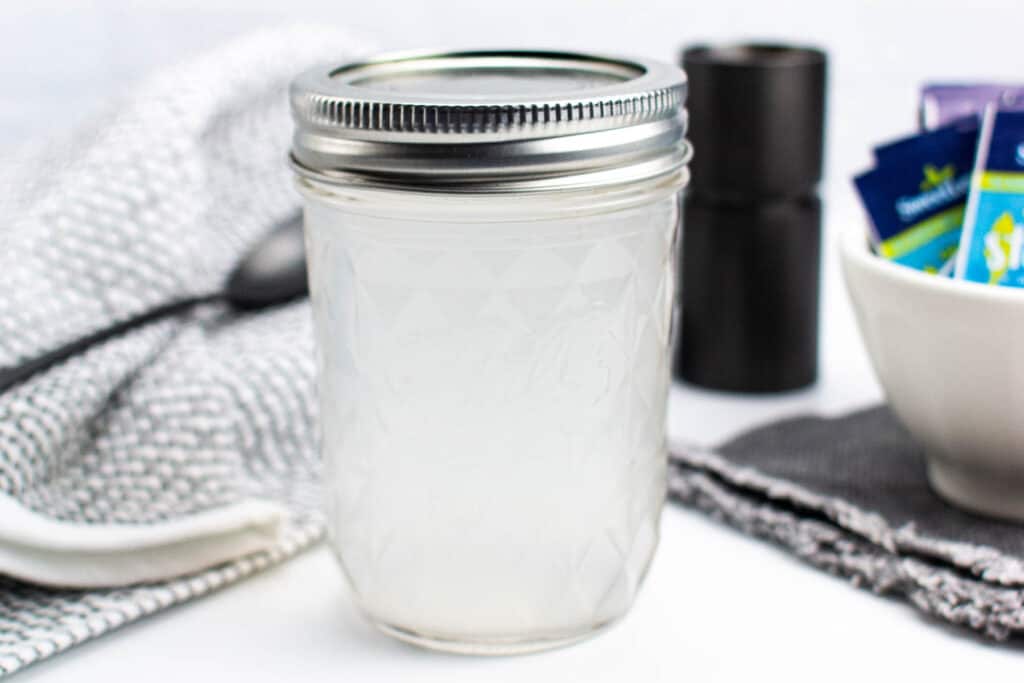 A mason jar of sugar free syrup.