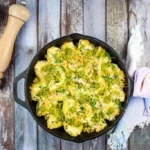 Turkey and Pesto Stuffed Pasta Shells in a black cast iron dish.