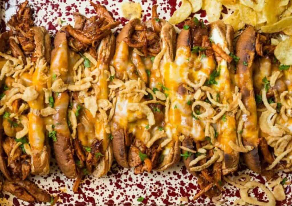 Overhead shot of sandwiches lined up on a platter.