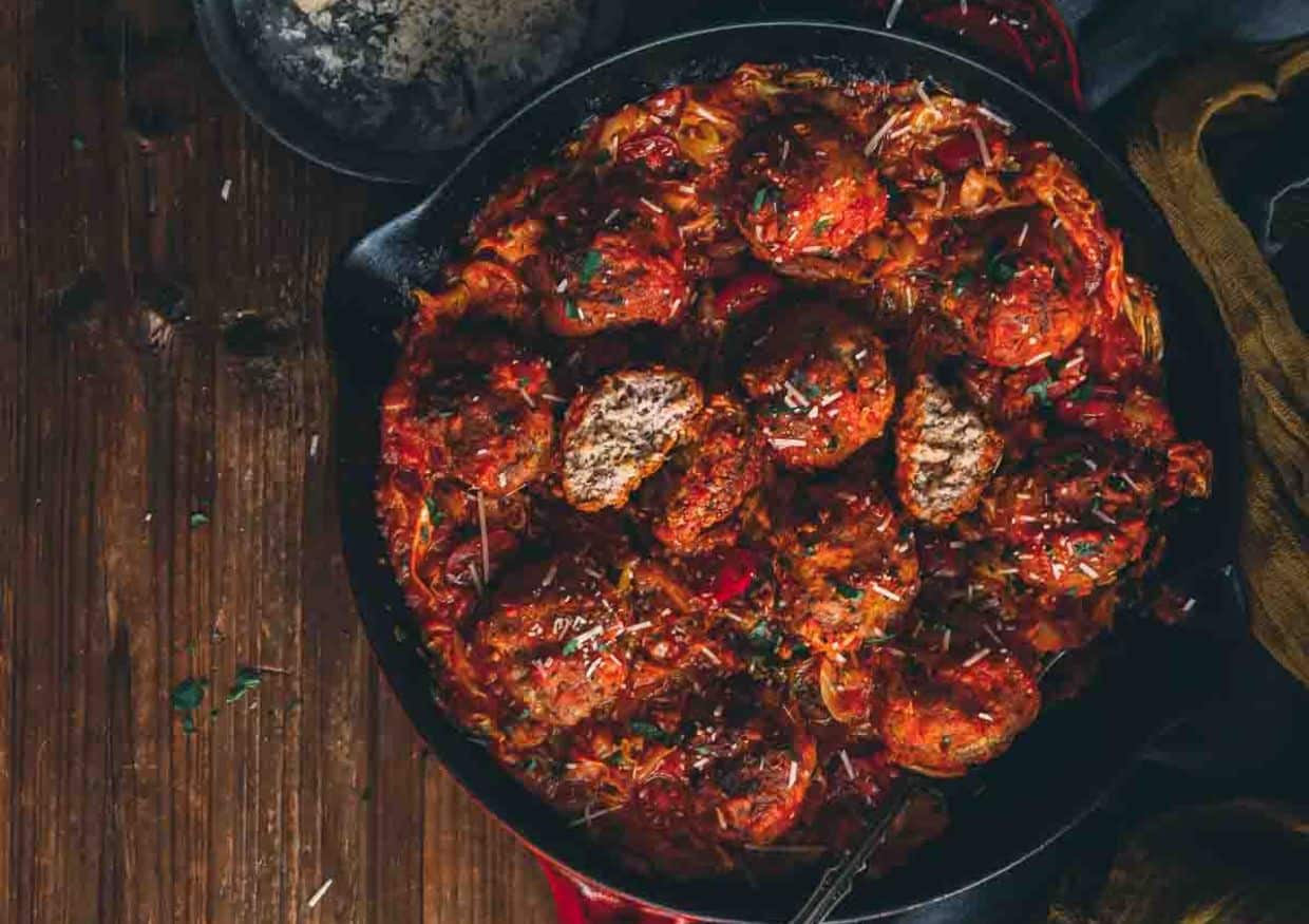 Skillet filled with meatballs.