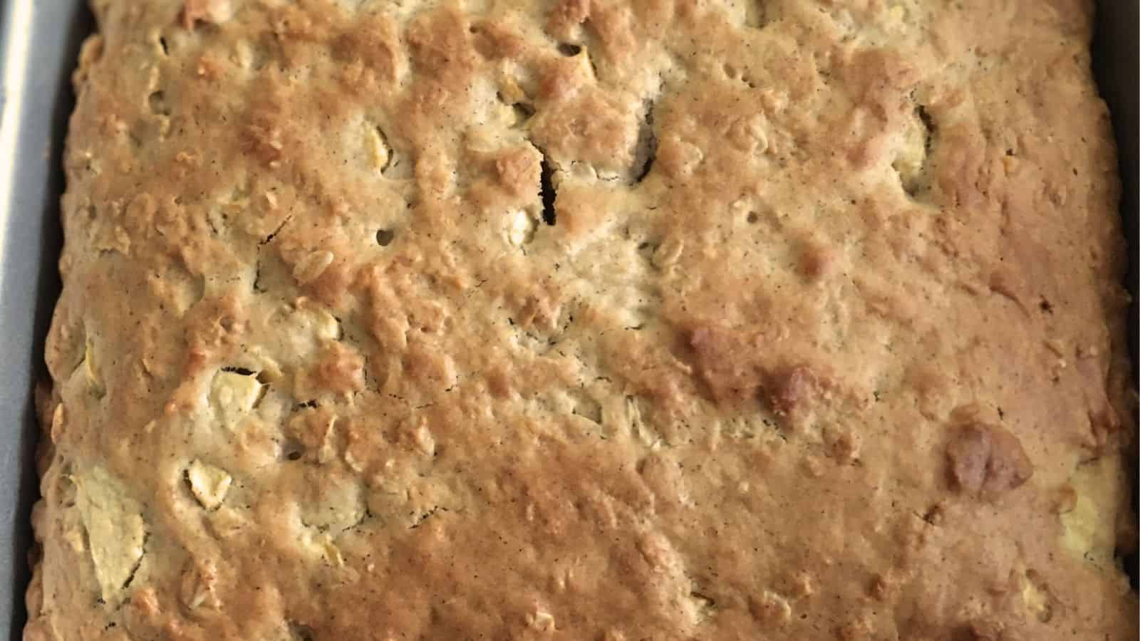 Closeup of a pan of apple sour cream coffee cake.