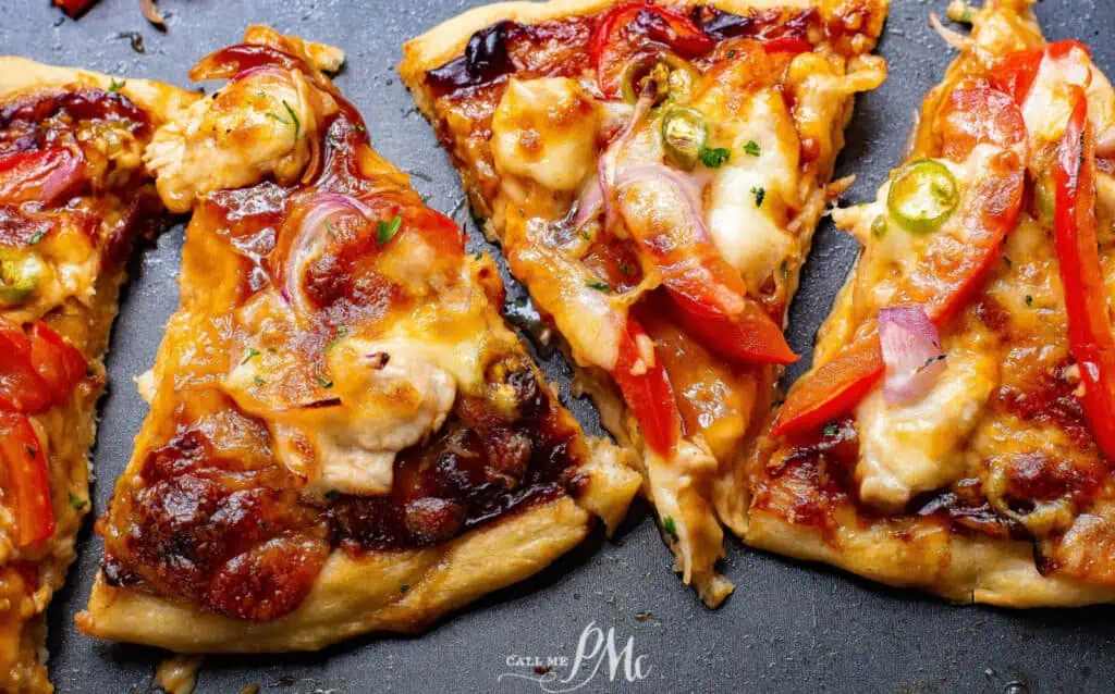A slice of pizza with peppers and onions.