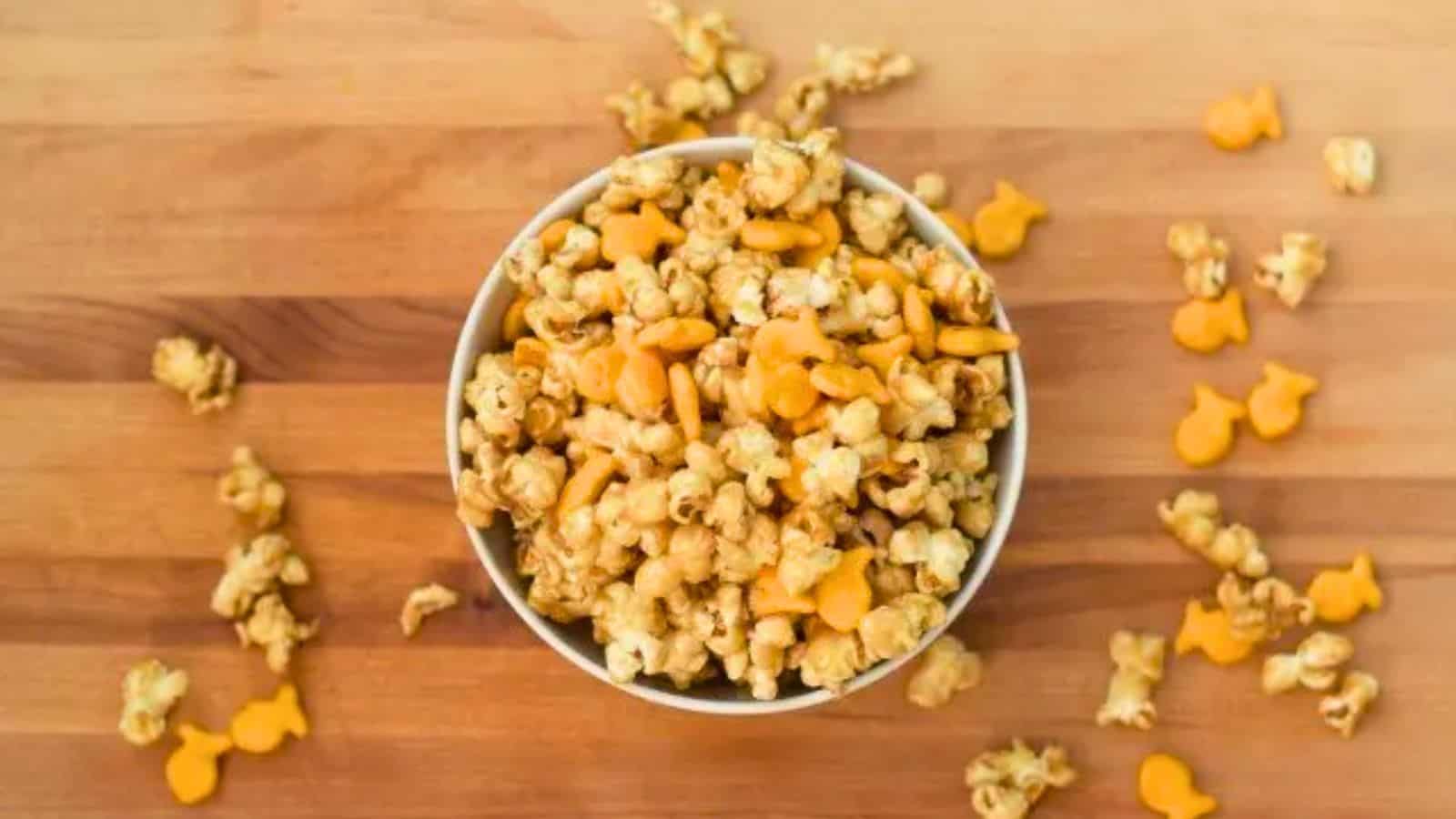 Image shows an overhead shot of Chicago style popcorn mix on a wooden table.